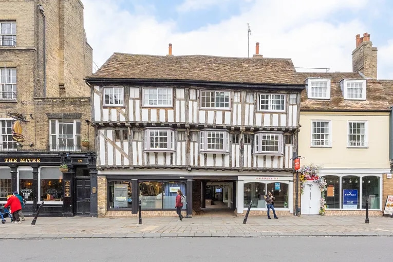 Historic high street building in the UK with overhanging upper floors, a common example of a flying freehold structure.