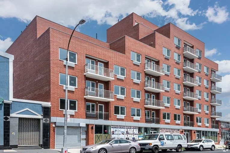 A brick apartment building in the Elmhurst neighborhood of Queens, NY.